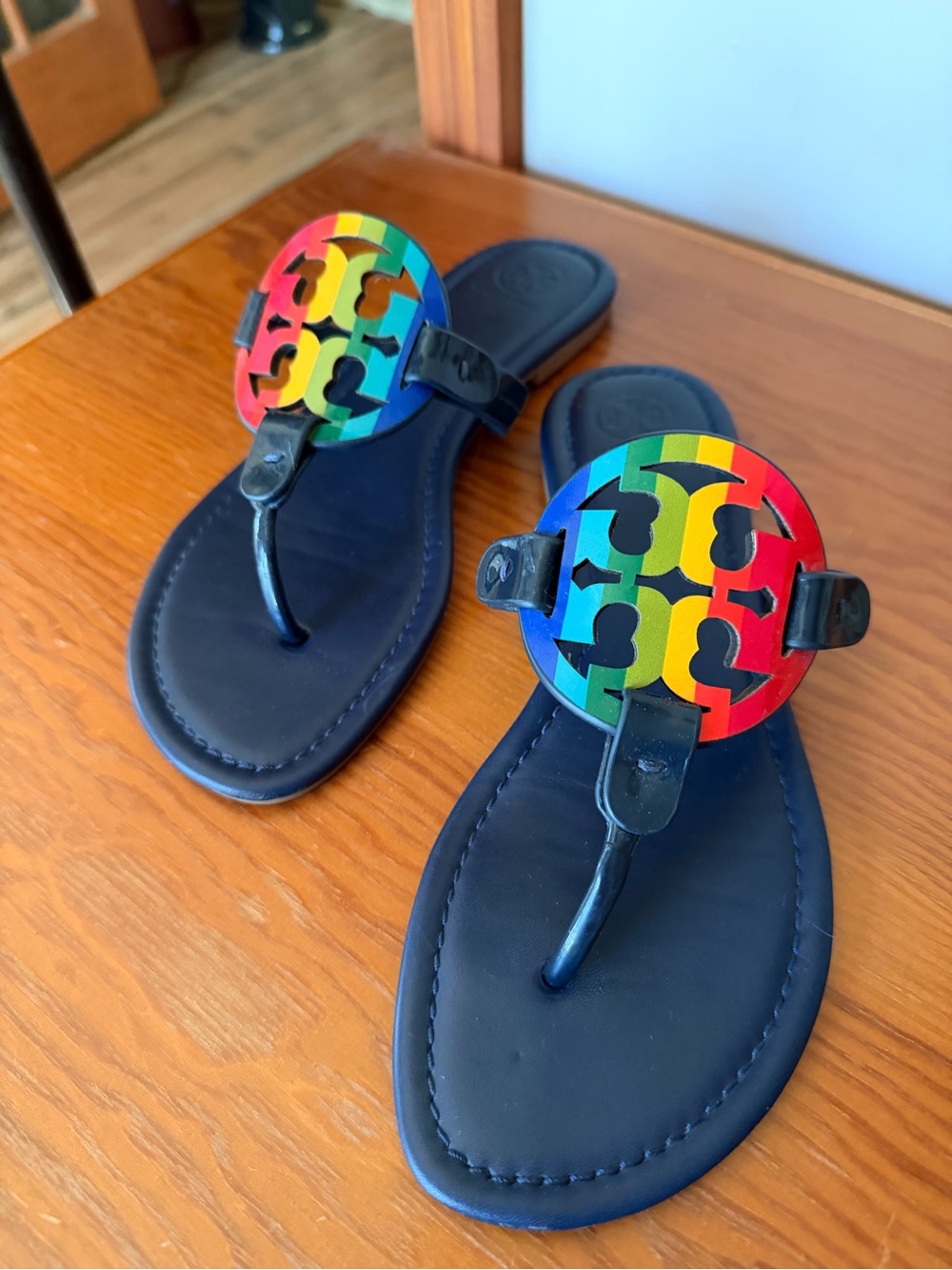 Tory Burch Black Sandals with Rainbow Logo Medallions